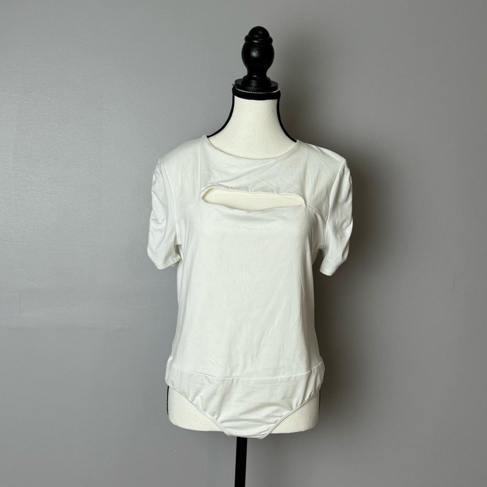 White Burch white bodysuit with chest cut out, snap closer size large